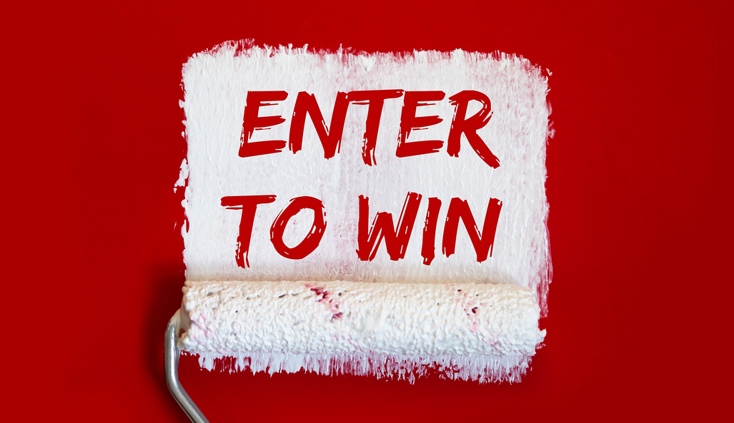 ENTER TO WIN .One open can of paint with white brush on red background. Top view.